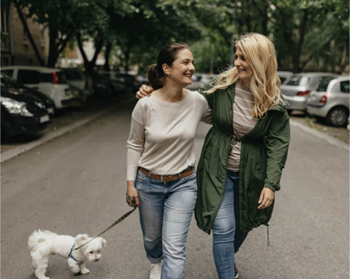 Three happy women drinking coffee
