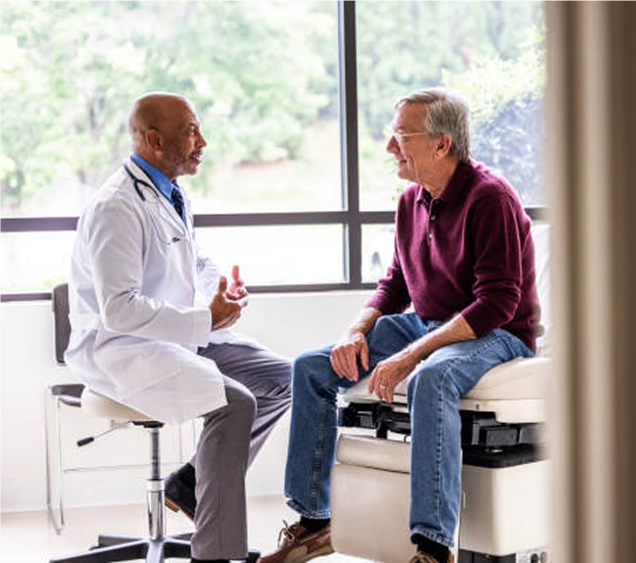 A man discussing prostate artery embolization with this doctor